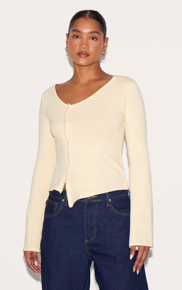 addc34daeb8a32593e3f026e7d54cd754ca04b34_CNM6354_1_almond_asymmetric_button_down_detail_long_sleeve_top