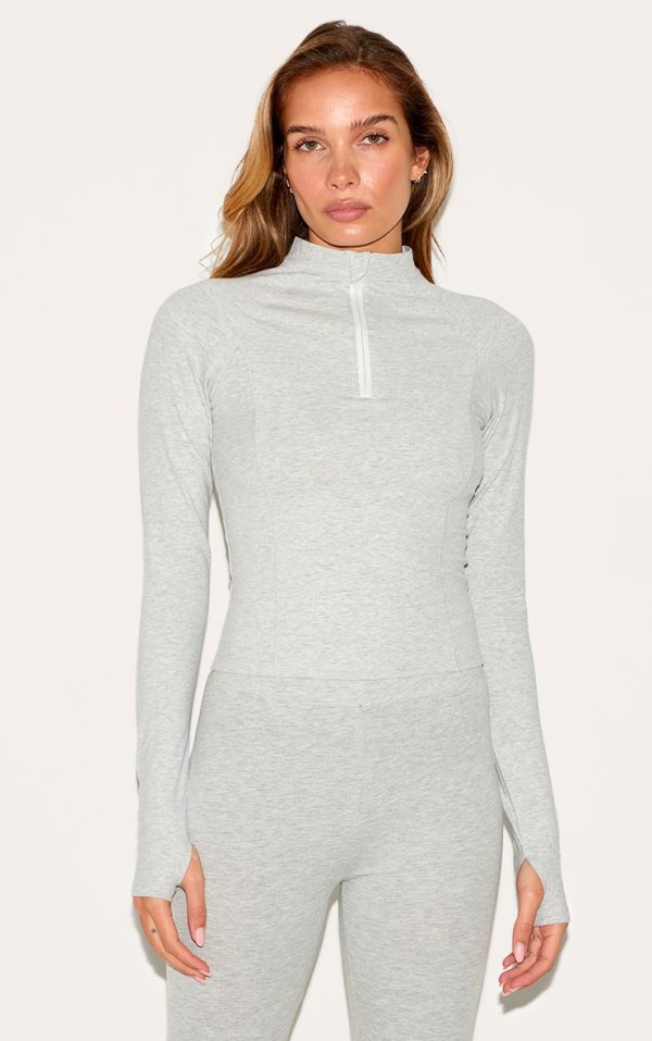 ae3a4bd12810a6298010ef1a3196f2649a6344c3_CNL6480_1_ash_grey_sculpt_quarter_zip_gym_top-1