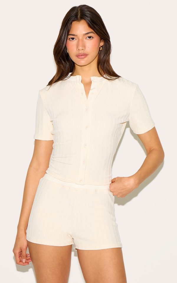 b164de5635bd86f1db455e7a01144e8e7ff1a692_CNM6176_1_butter_yellow_textured_button_up_longline_top