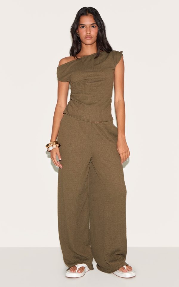b1d49c3ff730122f0bdaadb62d29bb210339f822_CNM8869_1_dark_green_textured_mid_rise_wide_leg_trousers