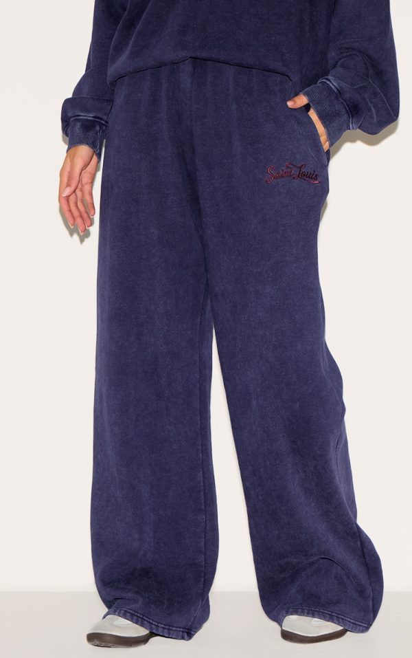 b3a1d44c1d30f75e29986db38ccc42500276c449_CNM4687_2_navy_saint_louis_embroidered_wide_leg_joggers