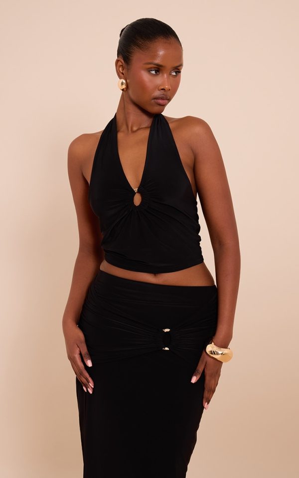 b5d1fa0aed83d46d6e969ce1215aa8a679947a65_CNM5200_1_black_gold_front_ring_detail_halterneck_top
