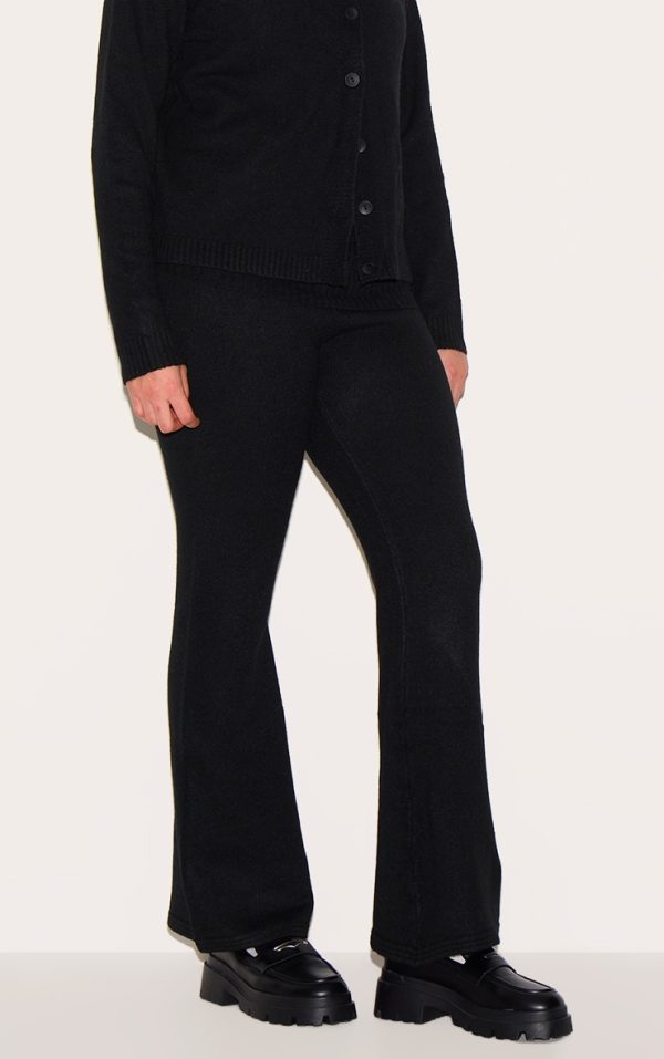 b6c4d4bd35cbbb76df9cc5786d552cf752d78096_CNJ1990_2_plus_black_melange_soft_knit_foldover_waist_flared_trousers