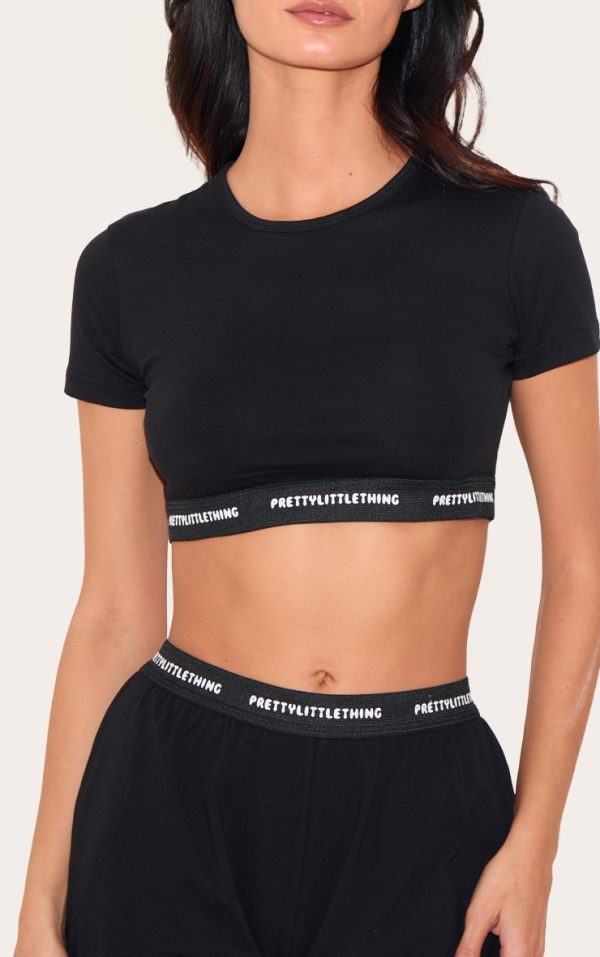 b71a36fe93a0242ac2e2d2b49a9267036681212c_CNK2315_4_prettylittlething_black_tape_short_sleeve_pj_top-1