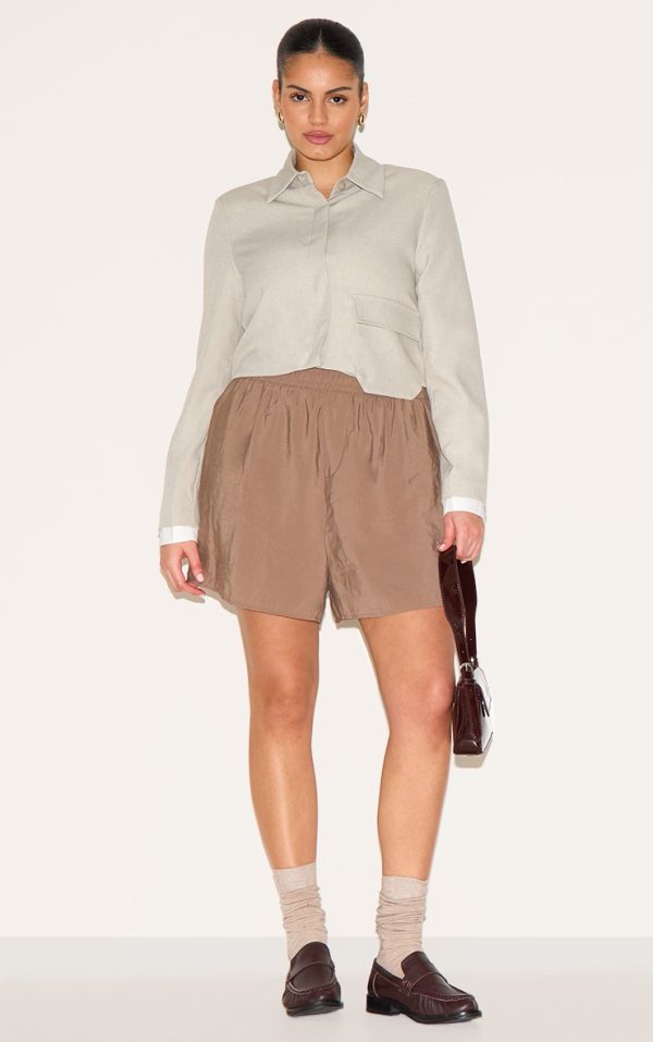 b9c1812938202c3eb51b1932cfd6604cac5e3b7c_CNM0267_1_plus_brown_peached_woven_elasticated_waist_shorts