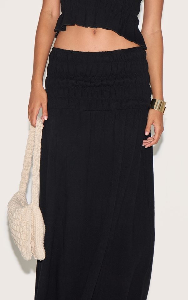 ba020e7f421bfefb1fd267138533127c0236810b_CNM9995_4_black_textured_shirred_panel_mid_rise_maxi_skirt