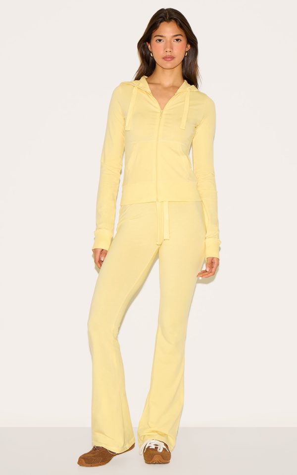 bbedae9497b5f260b9965d2f45d3223aee387701_CNN0641_3_butter_yellow_zip_up_fitted_track_top
