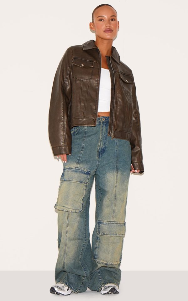 bcbe87e8aaa3820b4e9819e20252b8f0578829e3_CNH9752_1_plus_vintage_mid_wash_oversized_cargo_pocket_detail_wide_leg_jeans