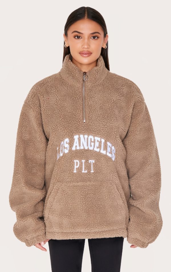 be1acf68c1cff259930a050b4a9fb6ac2a27f531_CNL1863_1_taupe_quarter_zip_pocket_detail_fleece