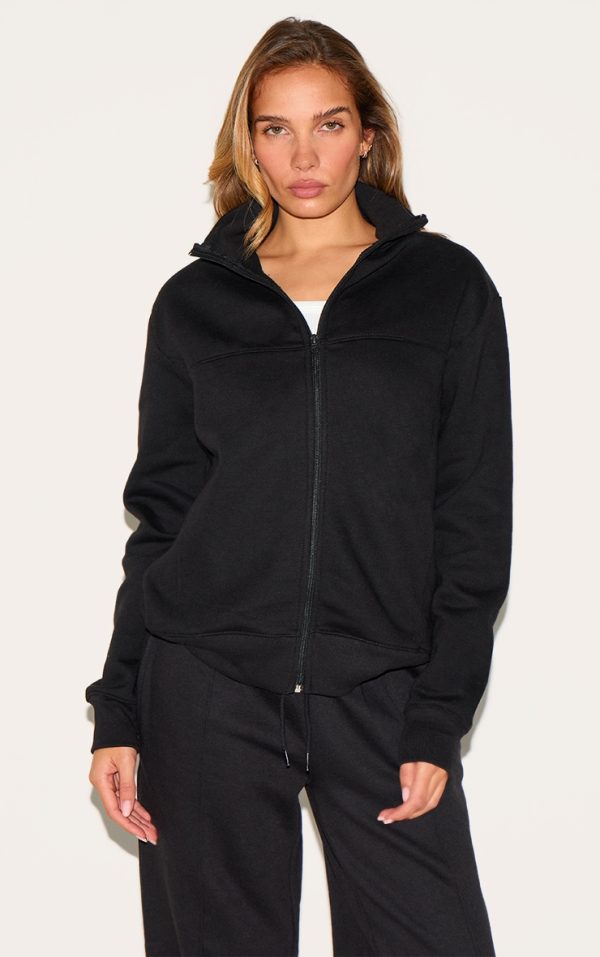 c2d4445d62487d0ad6744c6e3afe3e5266e55a3c_CNK9336_1_black_seamed_detail_zip_through_track_top