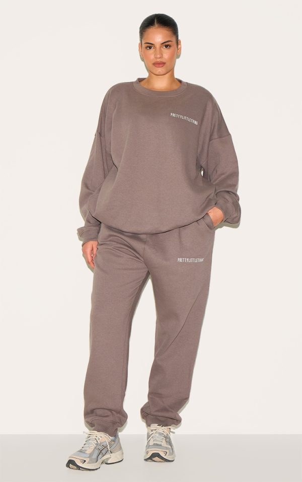 c3f27d822d5d991052008a61c962303211c53fd0_CNE5752_1_prettylittlething_plus_charcoal_grey_oversized_slogan_joggers