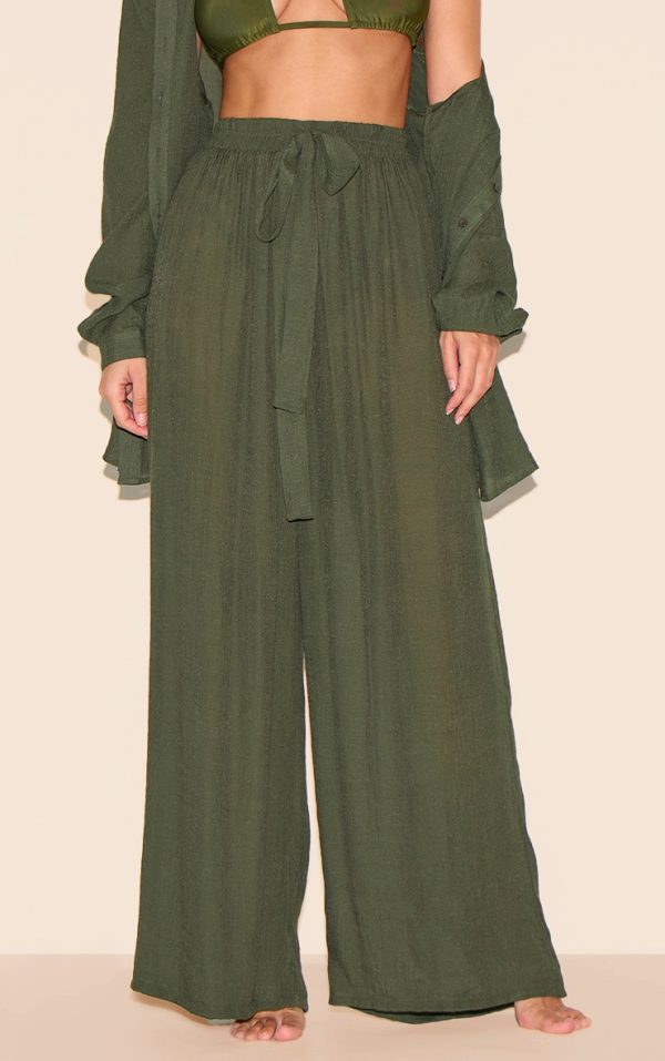 c56365c64ca91e97a9a2c8884e3085fd35886286_CNL6148_2_khaki_green_textured_woven_palazzo_beach_trousers
