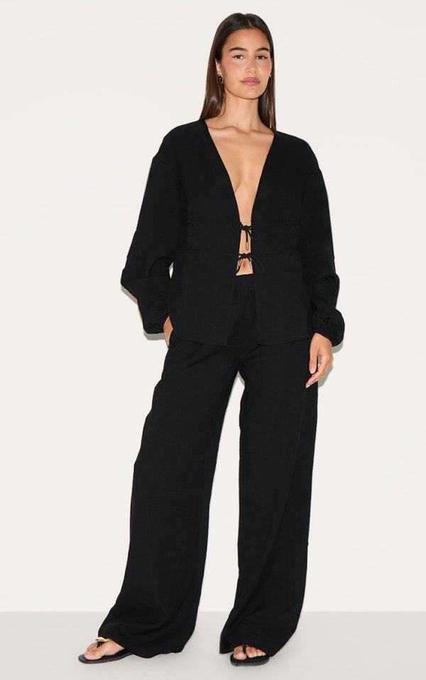 c70b7049c1d832f4f3d2836022e43abf3b2cd68b_CNM2109_3_black_ruched_side_long_sleeve_plunge_top