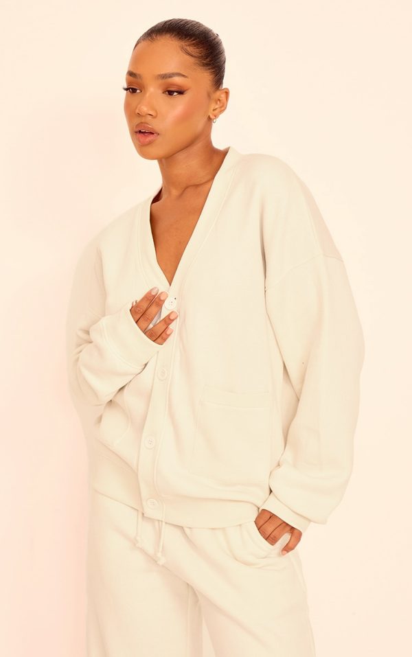 c780c3e700575798483fc304830b2f7b880c868e_CNJ8748_1_cream_button_front_pocket_sweat_cardigan