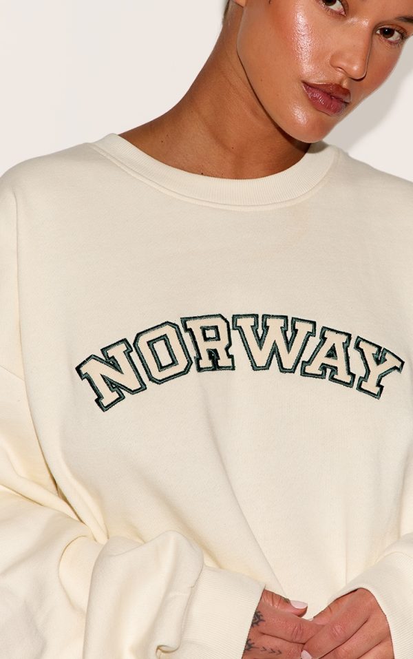 c858a9856f13da14fd84576b4031a94328f5db10_CNM1360_4_plus_cream_premium_embroidered_norway_sweatshirt