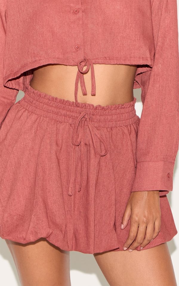 c8d24339135d528c581ab68e7671f1d6ace96834_CNM1731_5_rust_drawstring_puff_ball_skirt