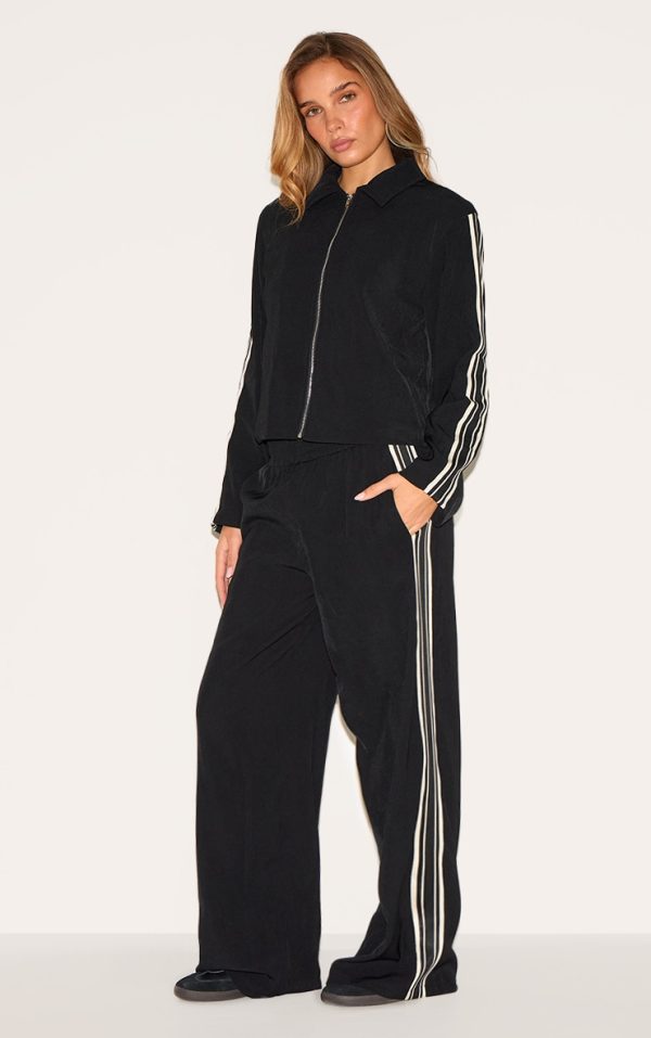 c9e5a7f73671c387e7b45eba327022f843e8557f_CNM0274_1_black_side_stripe_woven_wide_leg_trousers