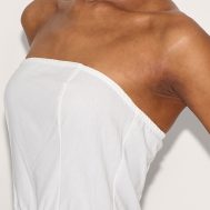 c9ec96c5368985a65c818a9687374c94d7dd9120_CNL8932_4_white_linen_bandeau_tie_waist_puffball_dress-1