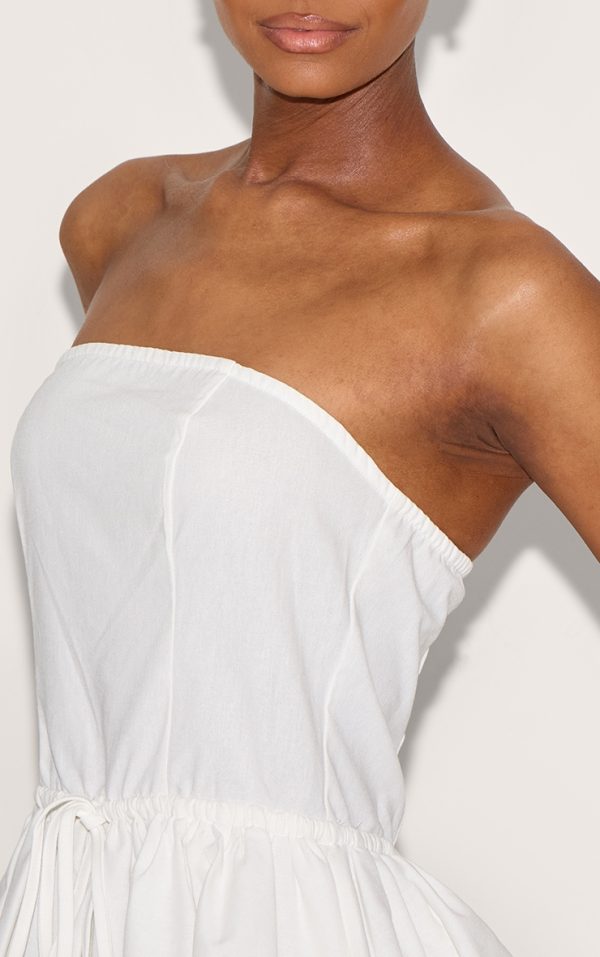 c9ec96c5368985a65c818a9687374c94d7dd9120_CNL8932_4_white_linen_bandeau_tie_waist_puffball_dress-1
