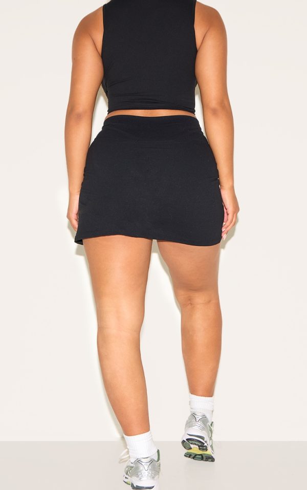 ce060f67bd3d87df70336764fa55022b31f857a5_CNM6294_3_shape_black_active_wrap_over_waist_skort