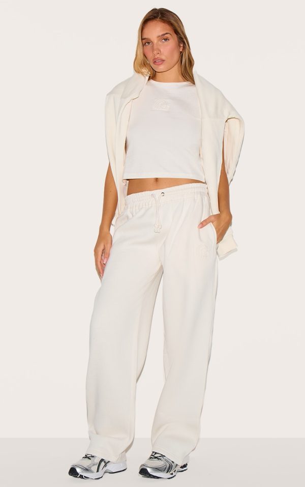 cec657a96b5b7db3066407d23ecc13245c4ee475_CNJ8741_1_cream_embossed_drawstring_joggers