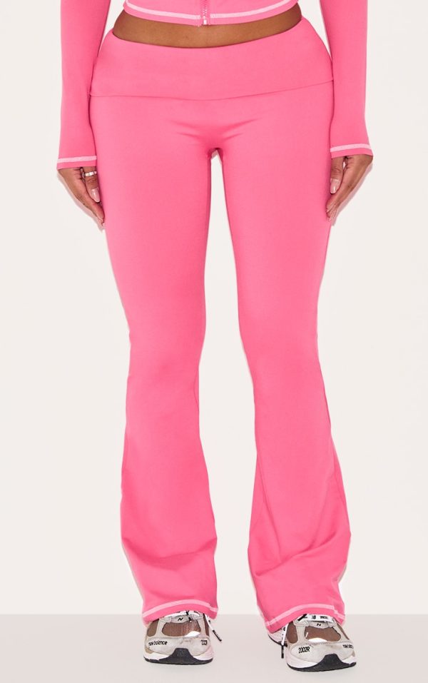 cffbfd562605d39bde275d58cf58a0b5cfb9c046_CNJ9555_2_shape_hot_pink_sculpted_contrast_stitch_foldover_waist_flare_trousers-1