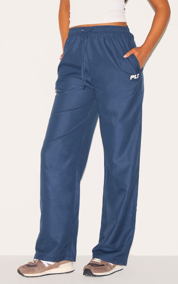 d197d82d4497465bdd6c00666de0e7d32e3fda27_CNL8298_2_prettylittlething_tall_navy_shell_drawstring_wide_leg_trousers
