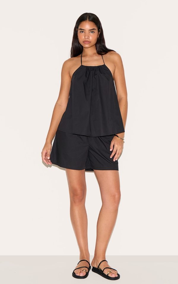 d2b7f51b43f4e5058342577c8a230de5e4755863_CNM5623_3_tall_black_poplin_low_back_halterneck_top