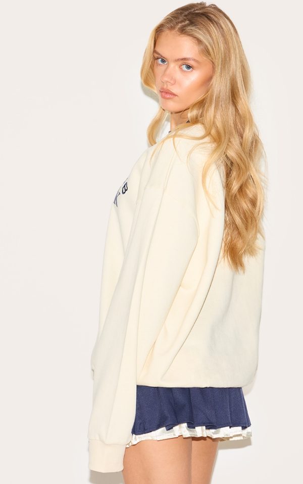 d39850698f565fa9146ea8bea008b0c7dc6aeaf8_CNM0209_2_cream_premium_contrast_neck_embroidered_sweatshirt