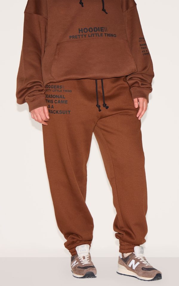 d5dba22e258bd43beaaa0d991979728befa9cb06_CNE5423_2_prettylittlething_plus_chocolate_slogan_print_joggers