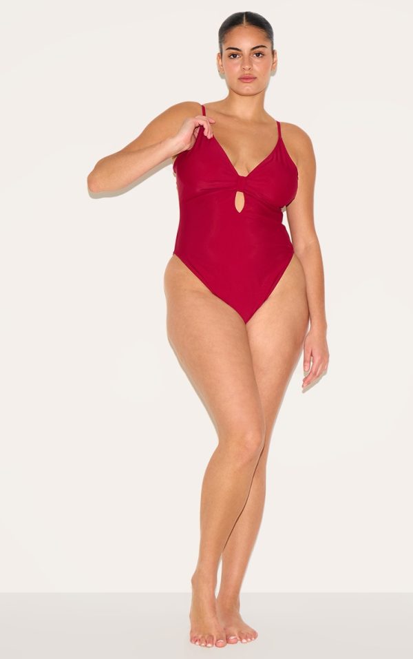 d6bcf1ac2862cfc6499dfd635799bb5c20bf9f45_CNM7882_3_plus_burgundy_knot_front_cut_out_swimsuit