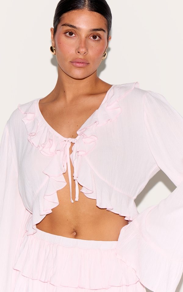 d6e2c80bc8379535d4957eb9a8edd51bfcefde6a_CNM3971_4_petite_pink_cheesecloth_ruffle_tie_front_long_sleeve_top