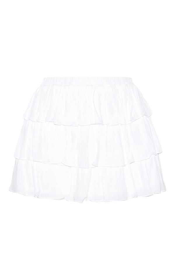 d9103f45593bba1afa36bc0c60173a89f23d63c6_CNM3231_5_white_cheesecloth_ruffle_tie_front_long_sleeve_top