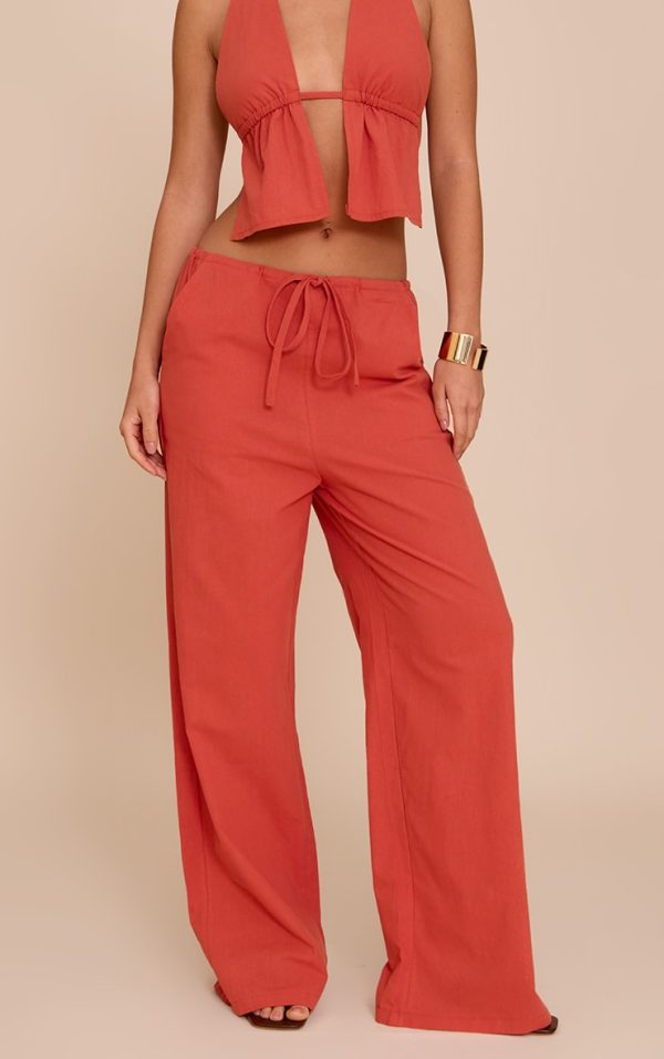 da9f6d2938f7fce089b0e2f7939bc54b7ad487a7_CNM5228_2_rust_cotton_low_rise_drawstring_wide_leg_trousers