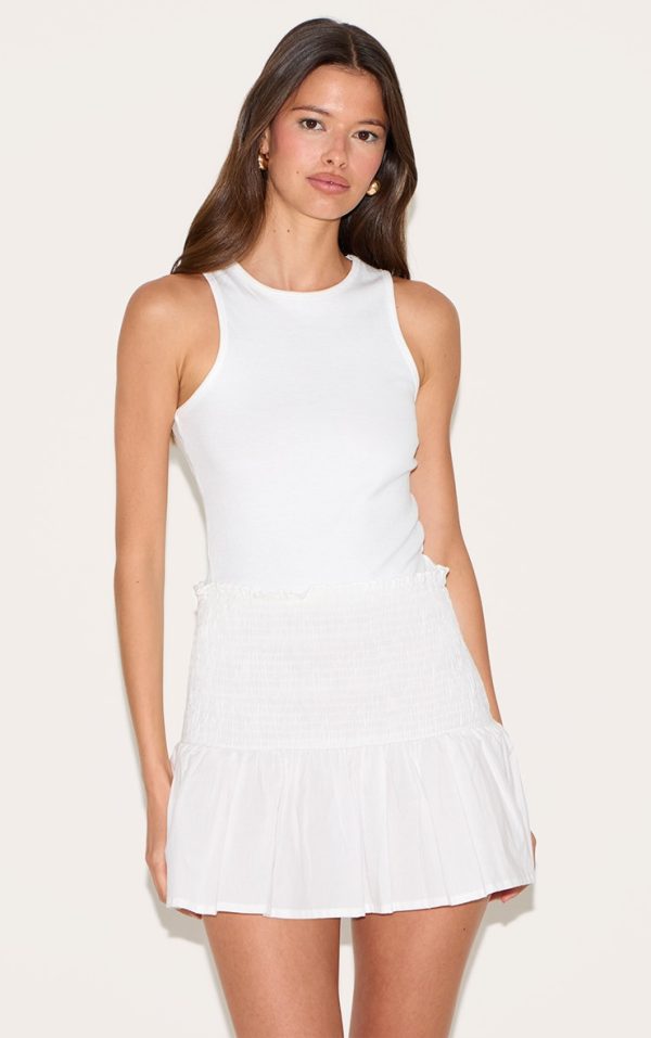 db6eaff557dbeba62291f48832cf2b22e5fce80d_CNM3426_1_white_cotton_shirred_drop_waist_mini_skirt