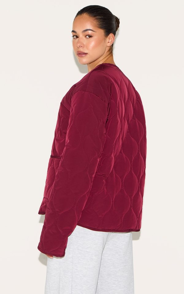 dbe529bdc0373c9cf344c590683a406f21c204ac_CNM1419_2_plum_zip_up_quilted_jacket-1