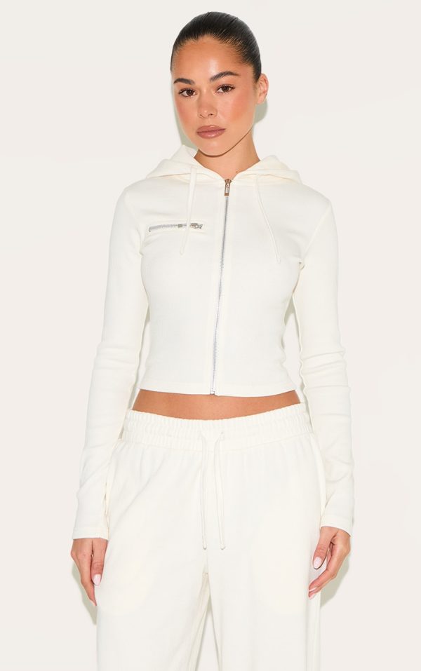 dc097f2a9807e3961388ae6486bcd7c09aa0f501_CNM2685_1_cream_zip_up_ribbed_track_top