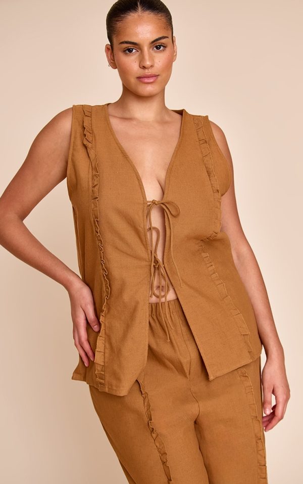 dd85d67c90e56ba95b4e5c22f68edf48b45be753_CNM5050_1_plus_tan_sleeveless_tie_front_top