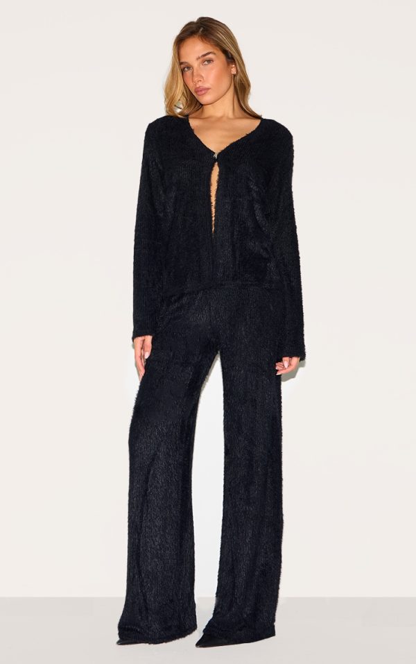 ddaebaf9b78eaace7fc044d25aa00c10e2cafc38_CNM2120_1_black_textured_wide_leg_low_rise_trousers-1