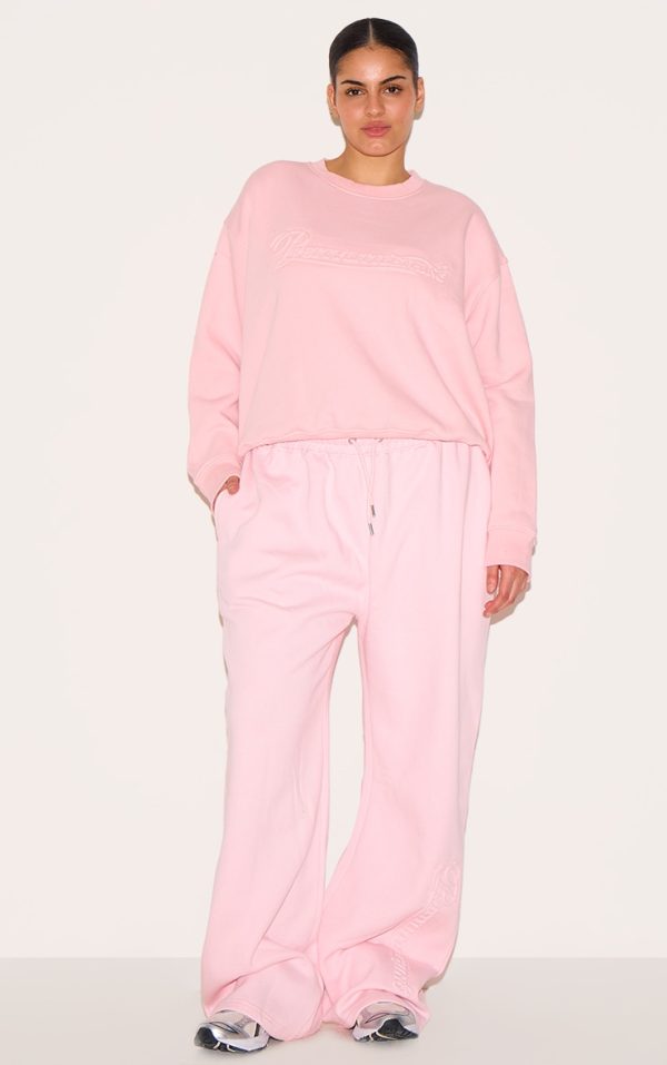 e5bda0998c954fda28c1bc3e04da26cc8c0dda0e_CNK3401_3_plus_baby_pink_embossed_graphic_oversized_sweatshirt