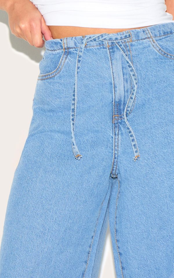 e7d5de9fd207e151d25fcf197176019185f834a8_CNL7054_4_petite_mid_blue_wash_low_rise_tie_waistband_wide_leg_jeans
