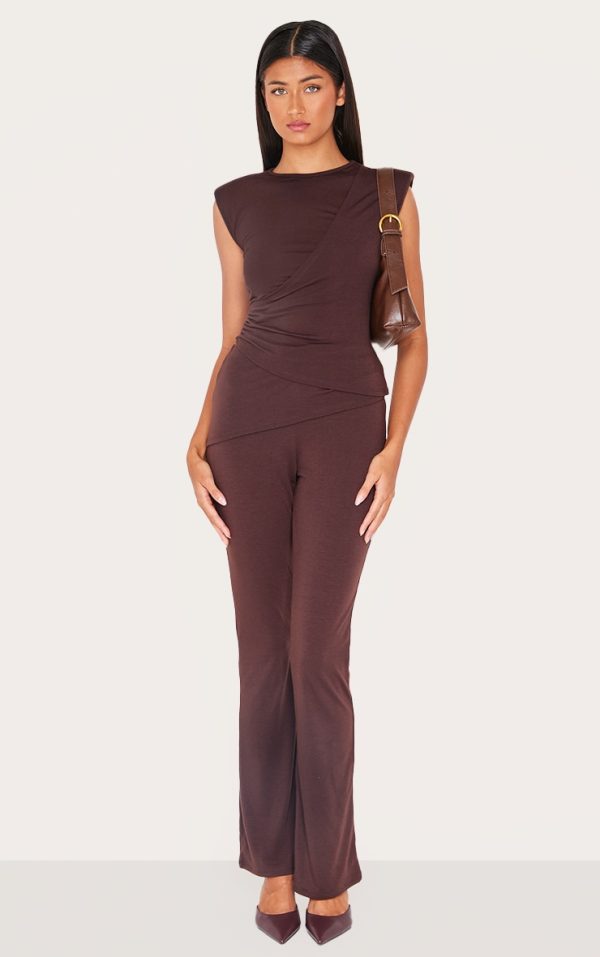 e898d3d579a43f7ac9d3d60cd2cf5e4f5f65e4d7_CNL4840_3_chocolate_jersey_padded_shoulder_ruched_asymmetric_top