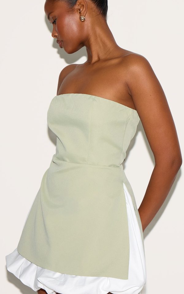 eb9e9026349fd8652007c7a951fadb7e69583255_CNL9038_4_sage_green_tailored_bandeau_puffball_hem_shift_dress