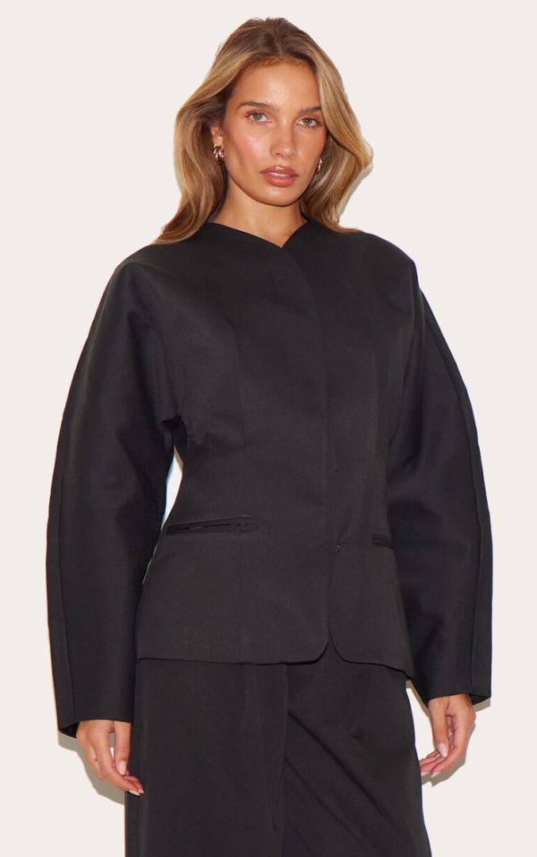 ed49c957e00df6b809f6cda0d77b3b84a55363bc_CNL7291_1_black_premium_woven_tailored_collarless_blazer
