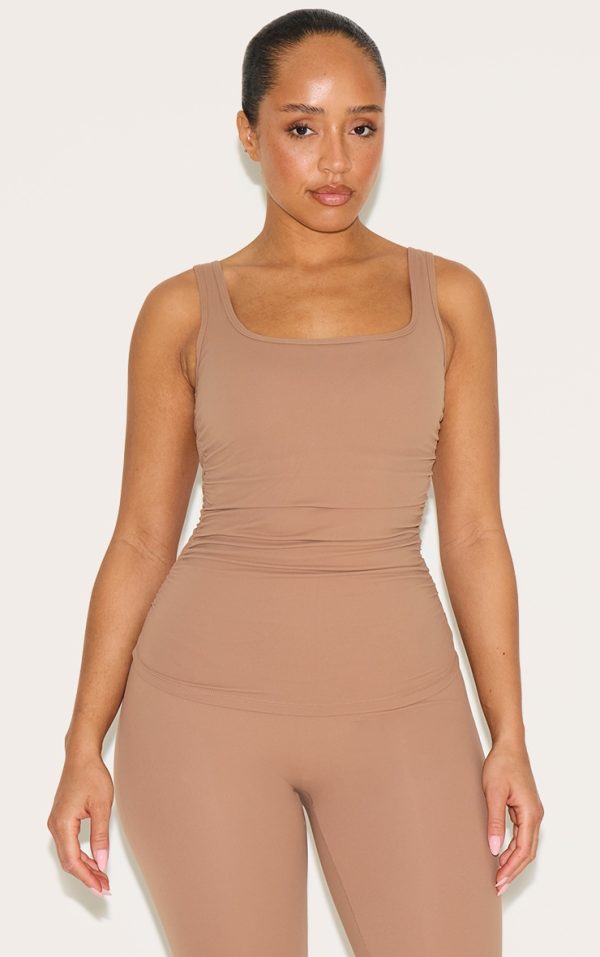 eda55609db18450af5329efb72cc56248372d9fe_CNM0970_4_shape_taupe_active_ruched_side_cupped_long_line_top