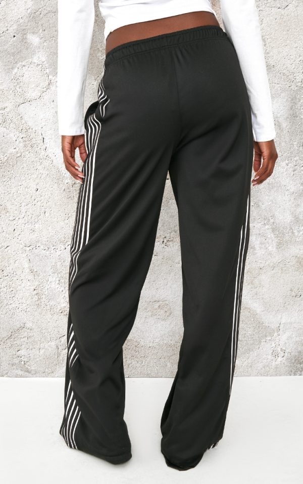 edea5c682c2c8c178914fd2bf64937aeea1c7381_CNK7321_3_tall_black_tricot_side_stripe_wide_leg_joggers