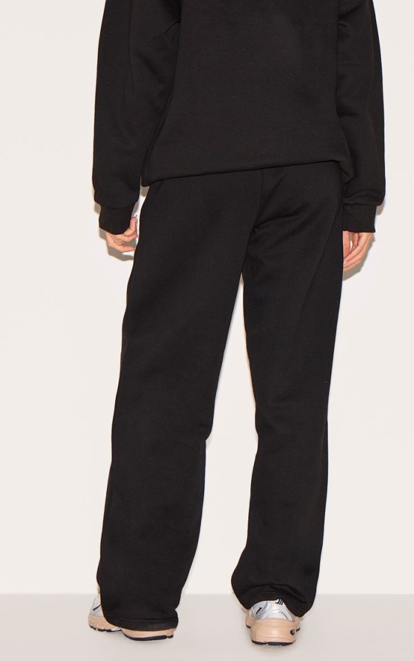 ee056ab89663eecb591b25fc8cd00c856e6fcff2_CNL9009_3_prettylittlething_black_logo_print_oversized_wide_leg_joggers