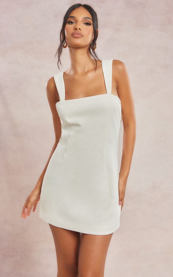 eed255209a7cba3628ca5a9492782df59eb53c59_CNF8755_2_cream_twill_cut_out_bow_shift_dress