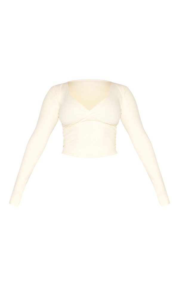 ef086acc2c60bb84a781b58abd4f55107b95c557_CNM8516_5_shape_bone_sculpt_active_wrap_v_neck_long_sleeve_top