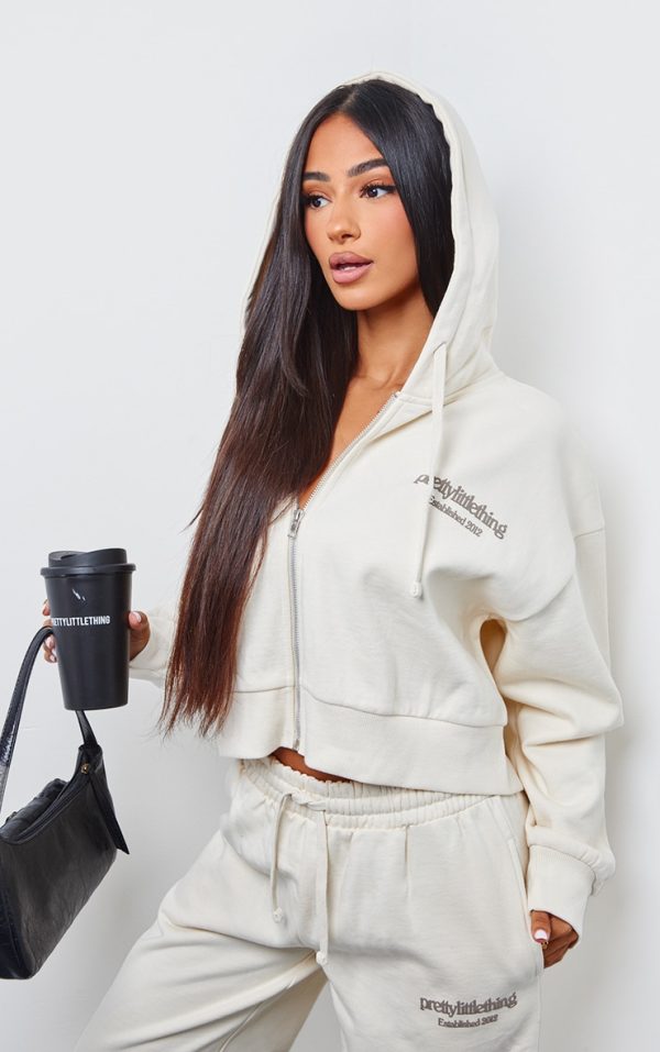 efcdf3612d97435d1ba7bc2e52db946750104e0f_CNK1317_1_prettylittlething_petite_cream_premium_print_zip_front_hoodie